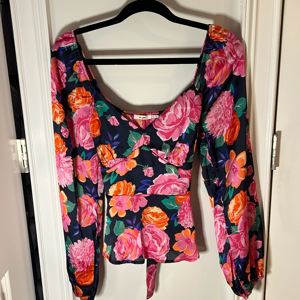 Floral blouse with bell sleeves and great stitch detailing and tie on back